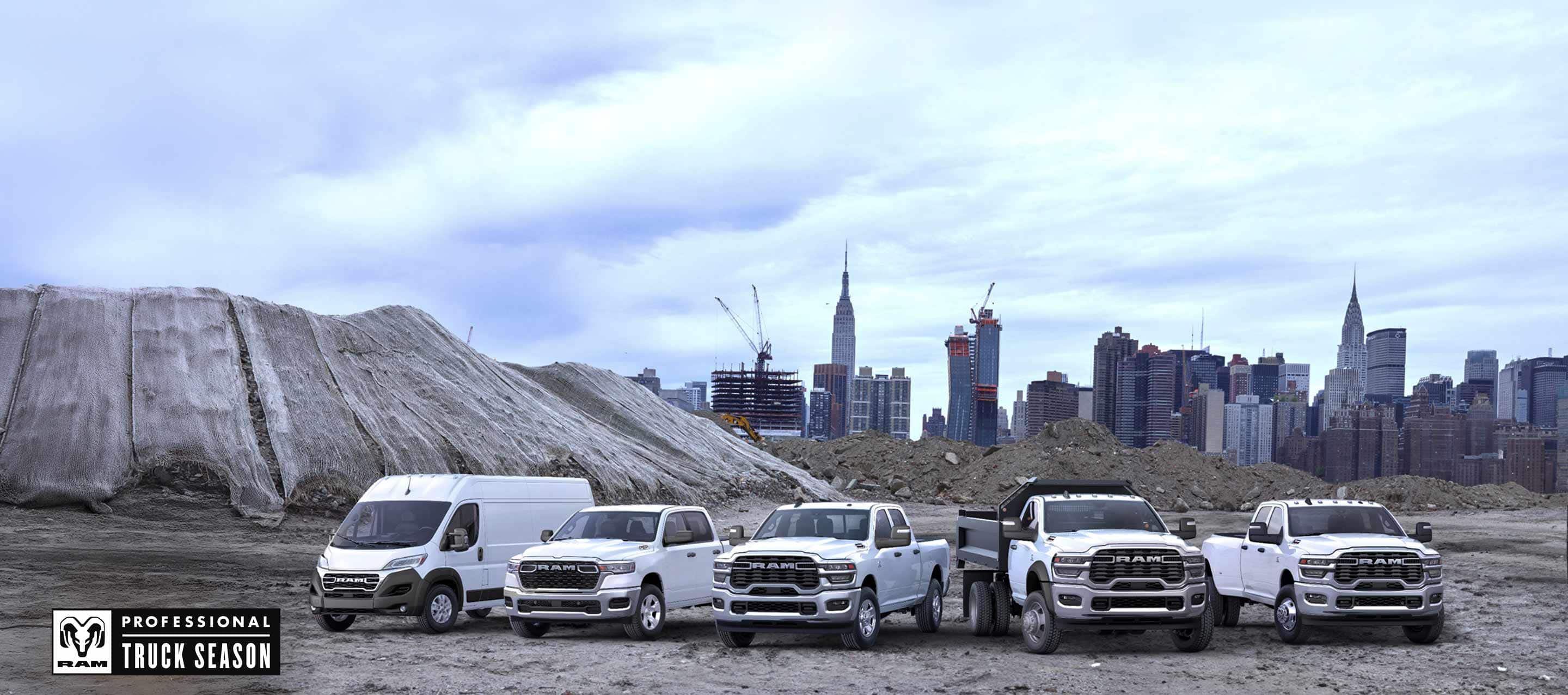 The 2025 Ram Brand lineup all in white, parked side-by-side at a pre-construction site, with a cityscape in the background. From left to right: a Ram ProMaster 3500 SLT High Roof Cargo Van, a Ram 1500 Tradesman 4x4 Crew Cab, a Ram 2500 Tradesman 4x4 Crew Cab, a Ram 5500 Tradesman Chassis Regular Cab with dump body upfit and a Ram 3500 Tradesman 4x4 Crew Cab. Ram Professional Truck Season.