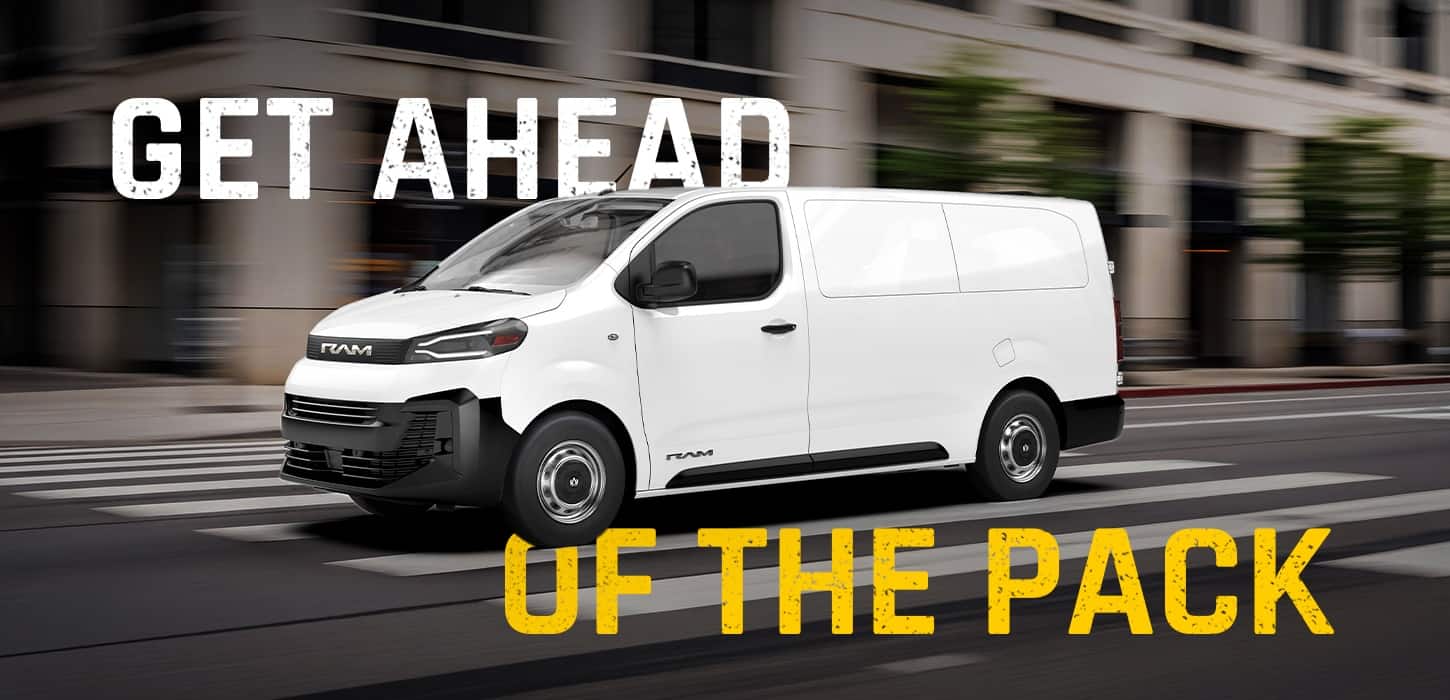 A white 2027 Ram ProMaster City Tradesman Cargo Van traveling down a city street. Get Ahead Of The Pack.