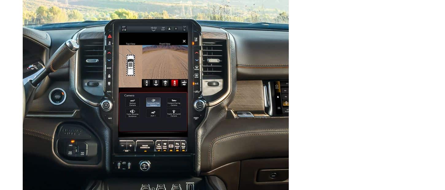 The Uconnect touchscreen in a 2025 Ram 3500 displaying a split-screen of two angles from the Surround View Camera.