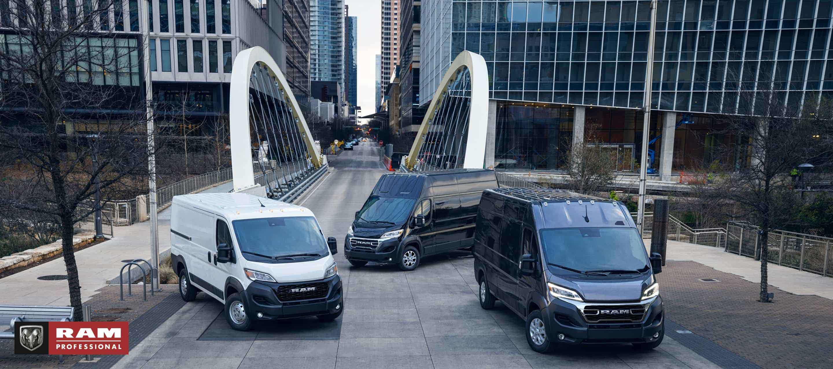 No changeThree 2024 Ram ProMaster models, from left to right: a white Ram ProMaster 1500 Tradesman Standard Roof Cargo Van, a black Ram ProMaster 3500 SLT+ Super High Roof Cargo Van and a black Ram ProMaster 3500 SLT High Roof Cargo Van parked just beyond a bridge in the center of a busy large city. Ram Professional.